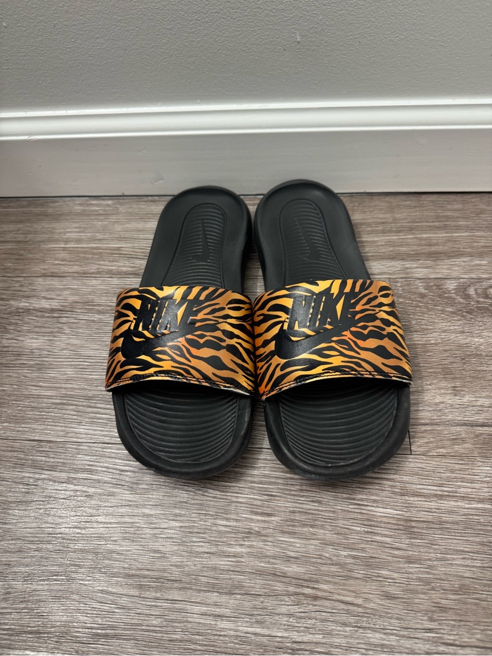 Nike Black Slides with Orange Tiger-Stripe Strap